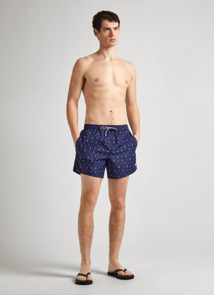 SWIM SHORTS WITH SURFING PRINT